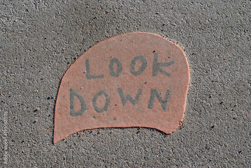 Descriptive Permanent Yellow Outdoor Sign on Pavement 'Look Down' 