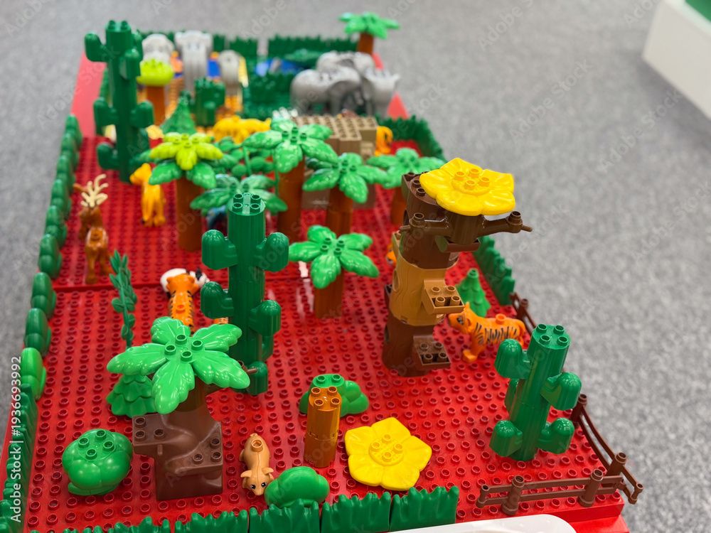 Fototapeta premium Toy jungle playset on red baseplate