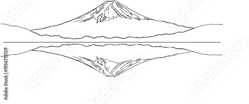 Majestic mountain peak mirrored in serene water under a clear sky