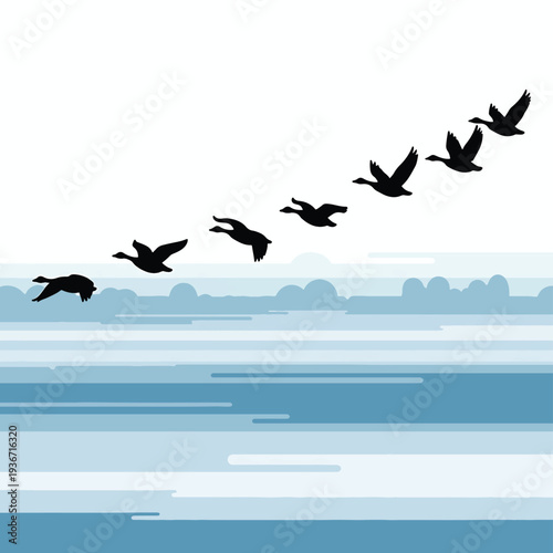 A flock of birds flying over a serene body of water