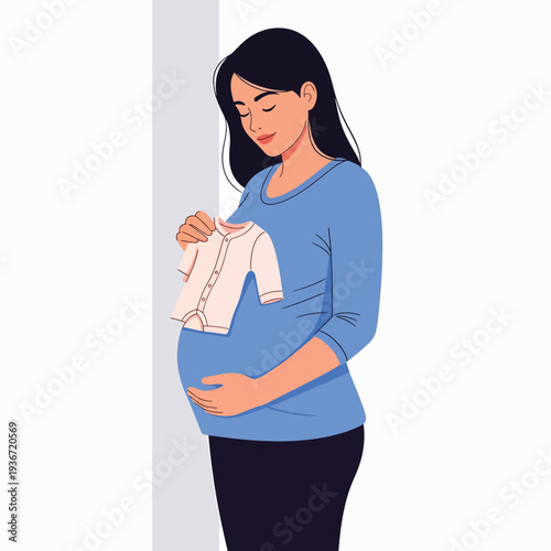 A pregnant woman holding a baby onesie