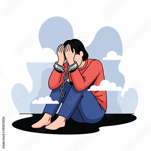A person sits chained and distressed