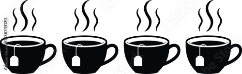 Four black tea cups with steam rising