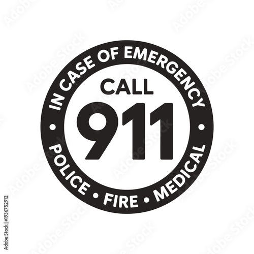 A circular black and white badge displaying information for emergency calls to 911