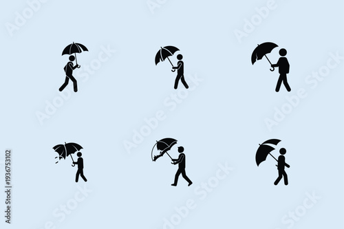 Silhouette of people struggling with umbrellas in the wind, armed forces day