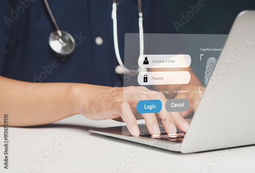 Doctor using laptop with healthcare login interface