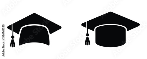 Black graduation caps with tassels on white background