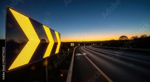 Evening Highway Sign Illuminates Direction With Vivid Yellow Against Dramatic Sunset