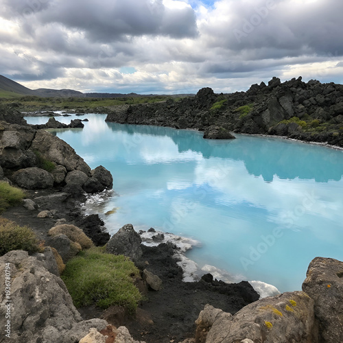 Blue lagoon surrounded by rugged rocks, crystal-clear water.