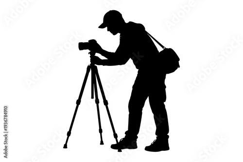 Silhouette of photographer with camera and tripod.