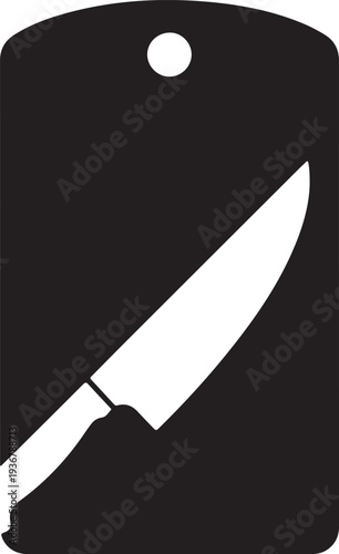 A black and white image of a knife on a cutting board
