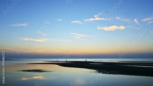 Time lapse stunning nature coastline during sunset in the summer time at Koh Samui. Fast motion footage on the beach with amazing colorful sky reflect on the surface of water.