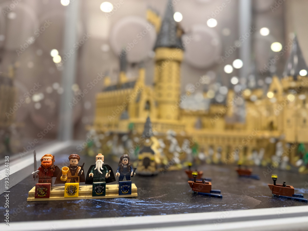 Fototapeta premium Lego minifigures on podiums with castle backdrop