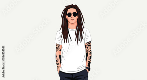 Stylish man with long dreadlocks, sunglasses, and full sleeve tattoos standing with hands in his pockets against a plain grey background.