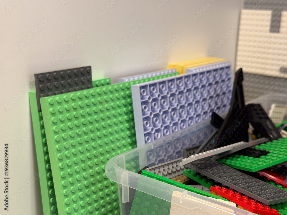 Fototapeta premium Stacked colorful building baseplates and bricks