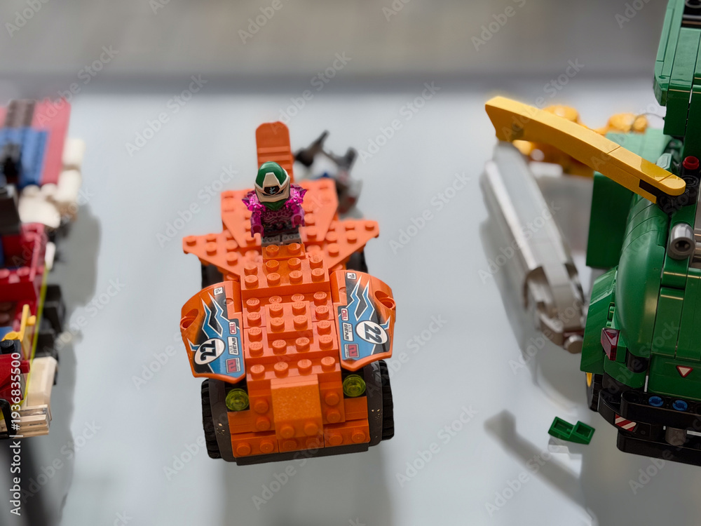 Fototapeta premium Orange lego racer with minifigure