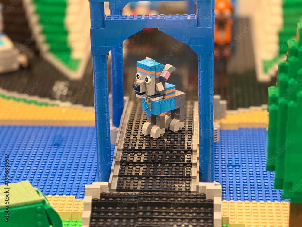 Fototapeta premium Lego dog on blue bridge over tracks