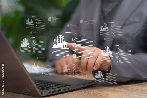 Real Estate management concept, Businessman Managing Real Estate Portfolio with Laptop Using Digital Checklist, Rating System to Improve Property Evaluation, Investment Planning,Transaction Efficiency
