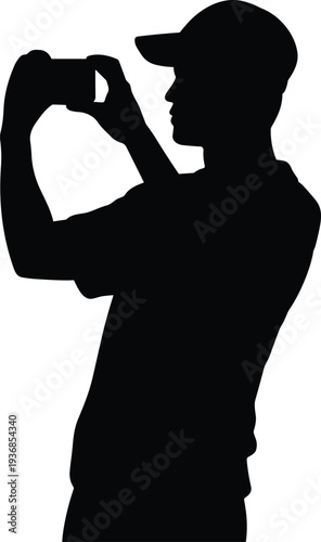 Man silhouette wearing cap using smartphone camera to take photo or record video, side profile photographer concept, mobile photography and digital content creation