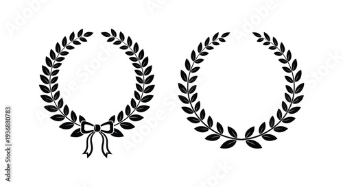 Two black and white laurel wreaths one with a ribbon displayed against a plain white background
