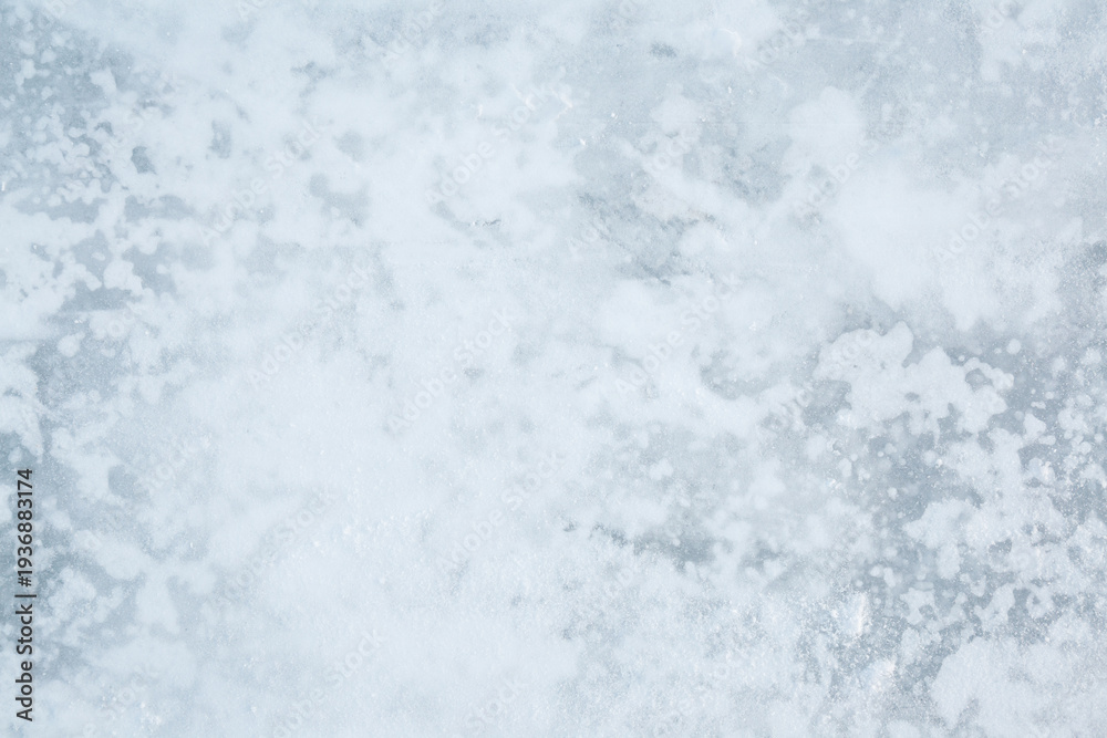 Obraz premium Snowy ice background. Closeup. Top down view.
