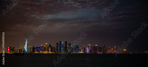 Doha, Qatar’s skyline of skyscrapers and harbor at night