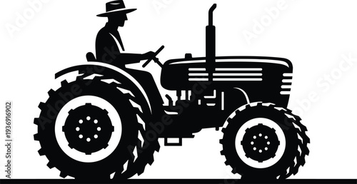 Black and white silhouette of a male farmer wearing a hat driving a vintage agricultural tractor on a field for farming and harvesting work.