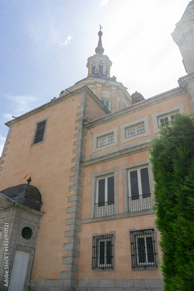 Fototapeta premium Historic building with ornate architecture and greenery.. Royal Palace of La Granja de San Ildefonso, Spain