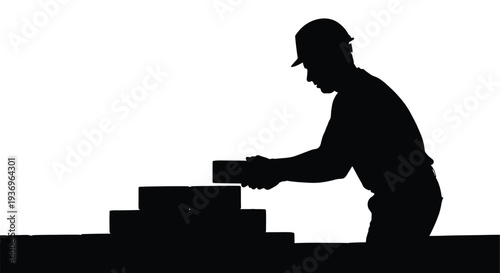 A dark silhouette of a construction worker carefully stacking bricks on a rooftop showcasing manual labor silhouette high quality