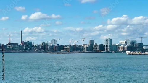 Scenic view of the kalasatama district in helsinki, finland, across the baltic sea on a sunny day