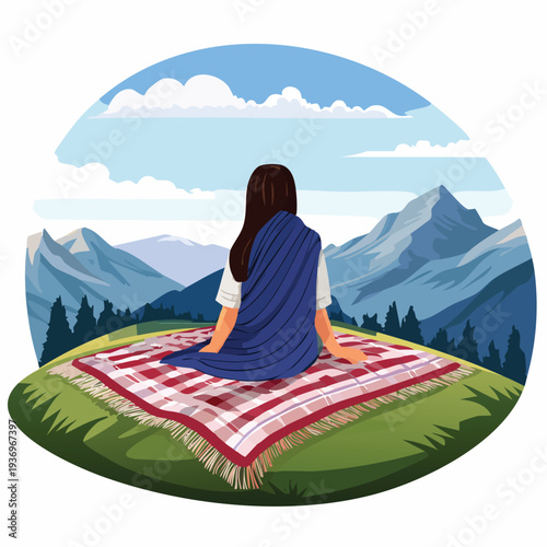 Woman on blanket gazing at mountain scenery