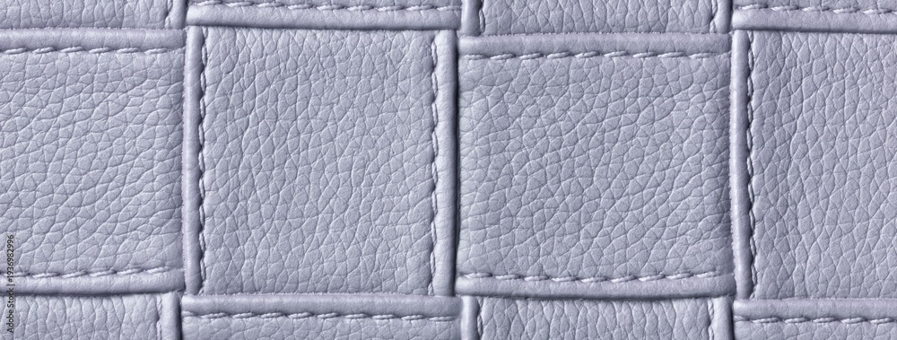 Fototapeta premium Texture light gray leather background with quilted stitched pattern, macro. Abstract silver upholstery surface