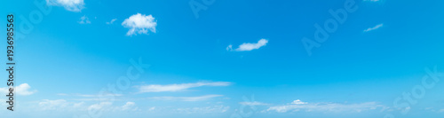 Photos Blue sky with few scattered white clouds