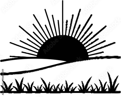 Silhouette of a sun rising over a horizon with blades of grass