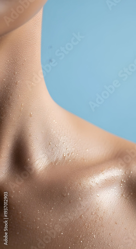 Wallpaper Mural Close up of a person's neck and shoulder with water droplets glistening on the skin against a soft blue background Torontodigital.ca