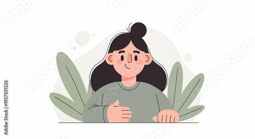 A person with dark hair in a bun and a grey shirt sits with plants