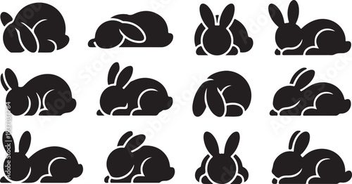 Twelve black silhouettes of rabbits in various resting positions curled up