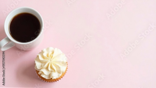 A Cup of Coffee and a Frosted Cupcake on a Pink Background
