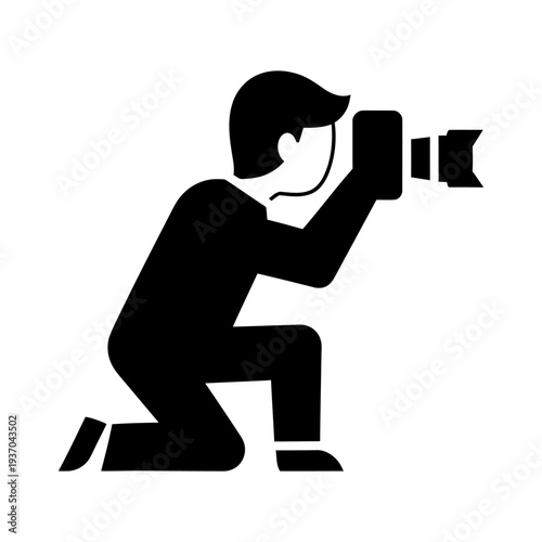 Photographer kneeling and taking a photo with a camera silhouette icon