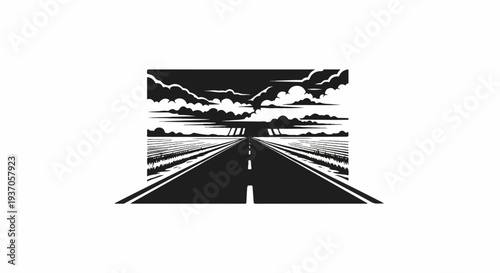 Endless road through fields under stormy, dramatic clouds