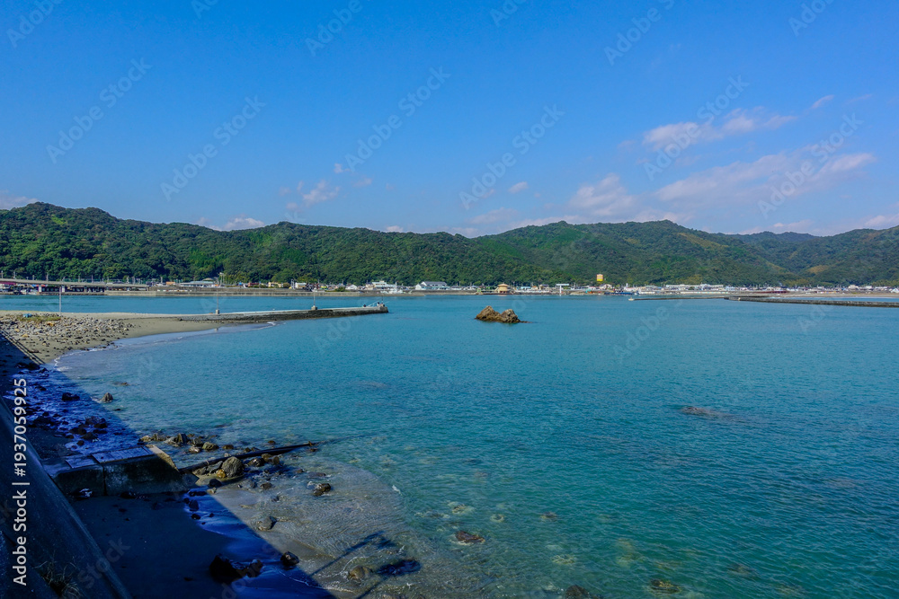 Obraz premium Calm Coastal Bay and Breakwater Landscape in Shikoku Japan
