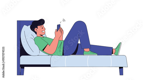 Young man lying comfortably in bed at night while holding his smartphone and looking at the screen with a happy expression.
