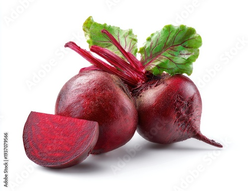 Two ripe, round root vegetables, one sliced, with green leaves, set on white background