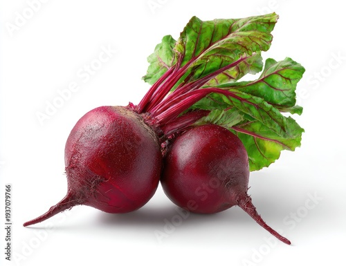 Two vibrant red beets with leafy green tops, set against a clean white backdrop