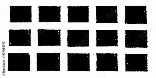 Arrangement of twelve rough black rectangular shapes on white background