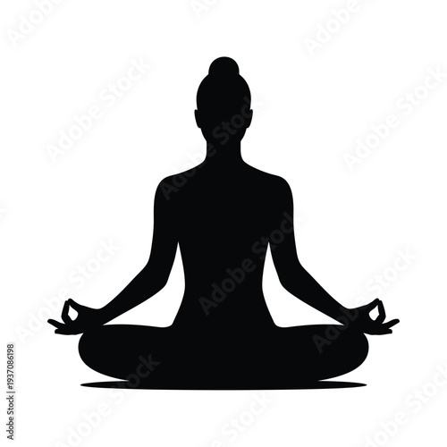 Silhouette of a woman practicing yoga in a meditative lotus position