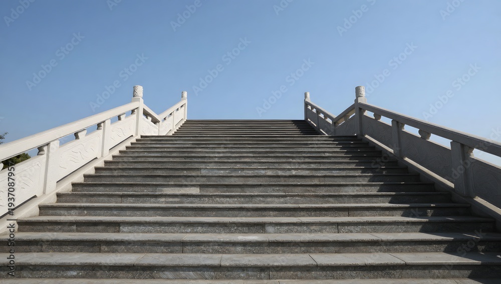 Obraz premium Grand stone staircase leading to an unknown destination under a clear sky
