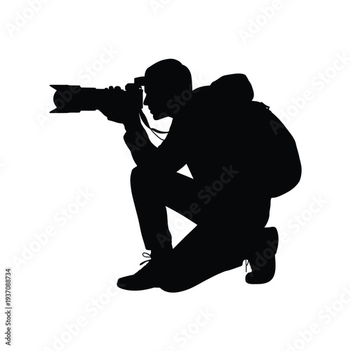 Silhouette of a photographer kneeling and taking a picture outdoors