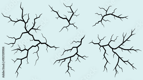 Set of black cracked lines on light blue background for graphic design elements  cracks and splits in various shapes and sizes