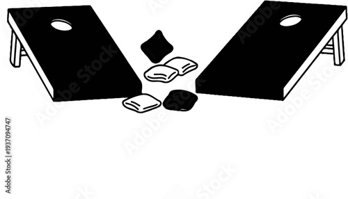 Two cornhole boards with beanbags scattered between them